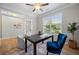 Home office with a dark wood desk, chair, and large windows for natural light at 307 Cochin Dr, Woodstock, GA 30188