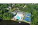 This aerial view shows the community pool, tennis courts, play area, lake, hiking trails, and canoe storage at 3338 Breton Ne Cir, Brookhaven, GA 30319