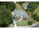 Aerial view of a beautiful home showcasing the landscaped yard and mature trees at 3338 Breton Ne Cir, Brookhaven, GA 30319