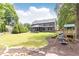 Sprawling backyard with playset and covered patio perfect for entertaining in this beautiful suburban home at 3338 Breton Ne Cir, Brookhaven, GA 30319