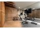 Finished basement with workout area, television, weights and mirrored wall ready for new homeowners to stay in shape at 3338 Breton Ne Cir, Brookhaven, GA 30319