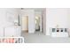 bedroom features light pink walls, white trim, carpet and a view to an ensuite bathroom at 3338 Breton Ne Cir, Brookhaven, GA 30319