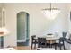 Cozy breakfast nook features a charming chandelier, banquette seating, and ample natural light at 3338 Breton Ne Cir, Brookhaven, GA 30319