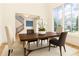 Light-filled dining room with large windows and elegant furniture, creating a perfect space for meals at 3338 Breton Ne Cir, Brookhaven, GA 30319