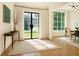 Bright dining area with large windows, hardwood floors, and modern decor at 3338 Breton Ne Cir, Brookhaven, GA 30319