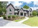 Stately brick home with professionally landscaped front yard and curved driveway at 3338 Breton Ne Cir, Brookhaven, GA 30319