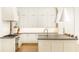 Modern kitchen featuring white cabinets, a stylish island, and sleek countertops at 3338 Breton Ne Cir, Brookhaven, GA 30319