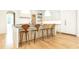 Bright kitchen features a large island with bar seating and modern white cabinetry, perfect for entertaining at 3338 Breton Ne Cir, Brookhaven, GA 30319