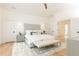 Spacious main bedroom features light wood floors, neutral colors, vaulted ceiling and a large rug at 3338 Breton Ne Cir, Brookhaven, GA 30319