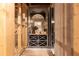 Intimate wine cellar boasting glass enclosure, custom racking, and stylish decor elements at 3338 Breton Ne Cir, Brookhaven, GA 30319