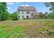 Expansive backyard featuring a charming deck, lush greenery, and a tranquil setting at 4915 Lazy Creek Ct, Cumming, GA 30028