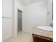 Bright bathroom features a neutral vanity with granite countertops, tiled flooring, and a standing shower at 4915 Lazy Creek Ct, Cumming, GA 30028