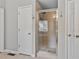 Bathroom featuring a glass door shower, neutral decor, and a tiled floor at 4915 Lazy Creek Ct, Cumming, GA 30028