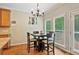 Breakfast nook area with wooded views and chandelier at 4915 Lazy Creek Ct, Cumming, GA 30028