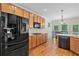 Bright kitchen with stainless steel appliances, oak cabinetry, and a breakfast nook at 4915 Lazy Creek Ct, Cumming, GA 30028