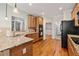 Kitchen featuring granite countertops, stainless steel appliances, and hardwood floors at 4915 Lazy Creek Ct, Cumming, GA 30028
