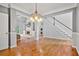 Open concept living room with hardwood floors and staircase at 4915 Lazy Creek Ct, Cumming, GA 30028