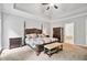 This main bedroom features natural lighting, a decorative ceiling, and neutral decor at 4915 Lazy Creek Ct, Cumming, GA 30028