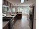 Modern kitchen features stainless steel appliances, granite countertops, and ample cabinet space at 1221 St James Pl, Loganville, GA 30052