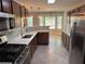 Modern kitchen features stainless steel appliances, granite countertops, and ample cabinet space at 1221 St James Pl, Loganville, GA 30052