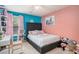 Vibrant bedroom with turquoise and pink color scheme, plush textures, and playful decor at 230 Haleys Ct, Woodstock, GA 30188