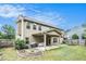 Exterior of home with backyard featuring a covered patio and ample green space at 230 Haleys Ct, Woodstock, GA 30188
