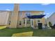 Backyard with a patio, a large grassy area, and mature trees at 2584 Grayton Loop, Villa Rica, GA 30180