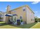 A two-story home showing the well-kept lawn with a beautiful patio, furniture, and manicured shrubs at 2584 Grayton Loop, Villa Rica, GA 30180