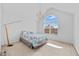 Bright bedroom with a vaulted ceiling and large arched window at 2584 Grayton Loop, Villa Rica, GA 30180
