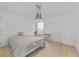 Well-lit bedroom with a modern light fixture, neutral walls, and large window at 2584 Grayton Loop, Villa Rica, GA 30180