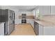 Well-lit kitchen with granite countertops and stainless steel appliances at 2584 Grayton Loop, Villa Rica, GA 30180