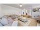 Spacious living room with large sectional sofa and staircase at 2584 Grayton Loop, Villa Rica, GA 30180