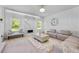 Sunlit living room with a marble fireplace and comfortable seating at 2584 Grayton Loop, Villa Rica, GA 30180