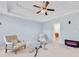 Inviting living room featuring a trey ceiling, fireplace, and modern furniture at 2584 Grayton Loop, Villa Rica, GA 30180