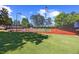A community tennis court with new paint and fence with a well-maintained lawn at 2584 Grayton Loop, Villa Rica, GA 30180