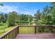 Enjoy the view of the serene pond and lush greenery from this property's lovely back deck at 2681 Lakeside Sw Dr, Conyers, GA 30094