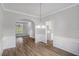 Dining room featuring modern wainscoting, lighting, and open floor plan at 2681 Lakeside Sw Dr, Conyers, GA 30094