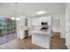 Bright kitchen with stainless steel appliances, white cabinets, and quartz countertops at 2681 Lakeside Sw Dr, Conyers, GA 30094