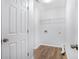 Clean and functional laundry room with storage shelves and space for washer and dryer at 2681 Lakeside Sw Dr, Conyers, GA 30094