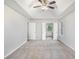 Bright main bedroom with carpet, large windows, and ensuite bathroom access at 2681 Lakeside Sw Dr, Conyers, GA 30094