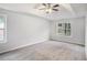 Spacious main bedroom with ample natural light and a tray ceiling at 2681 Lakeside Sw Dr, Conyers, GA 30094
