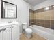 Bathroom with single vanity and tub/shower with neutral tile at 3924 Chimney Ridge Ct, Ellenwood, GA 30294