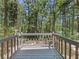View of the deck overlooking a beautiful, green wooded area at 3924 Chimney Ridge Ct, Ellenwood, GA 30294