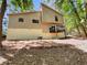 The back exterior of the house showing the siding, deck and yard at 3924 Chimney Ridge Ct, Ellenwood, GA 30294