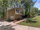 Side of house with garage and yard at 3924 Chimney Ridge Ct, Ellenwood, GA 30294