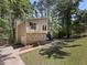 Beautiful exterior showcasing well-maintained lawn and charming stone details at 3924 Chimney Ridge Ct, Ellenwood, GA 30294