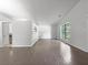 Spacious living room featuring hardwood floors, and ample light from the window at 3924 Chimney Ridge Ct, Ellenwood, GA 30294