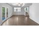 Bright and airy living room features patio access and easy access to stairs at 3924 Chimney Ridge Ct, Ellenwood, GA 30294