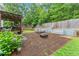 Back patio with a lounge area, seating and a fire pit for entertaining guests at 9048 River Bend Ct, Villa Rica, GA 30180
