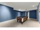 Finished basement featuring a pool table with recessed lighting for an open game space at 9048 River Bend Ct, Villa Rica, GA 30180
